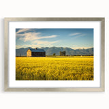 Textured abstract art print of Montana scenery in muted earth tones, framed in silver, ideal for bedroom decor.