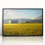 Large abstract wall art depicting a Montana landscape in muted earth tones, framed in black acrylic.