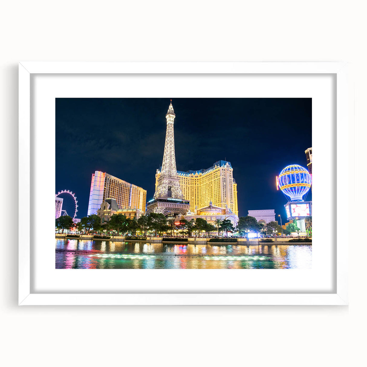 Abstract art print of Las Vegas skyline in muted gray and blue tones on a framed white mat.