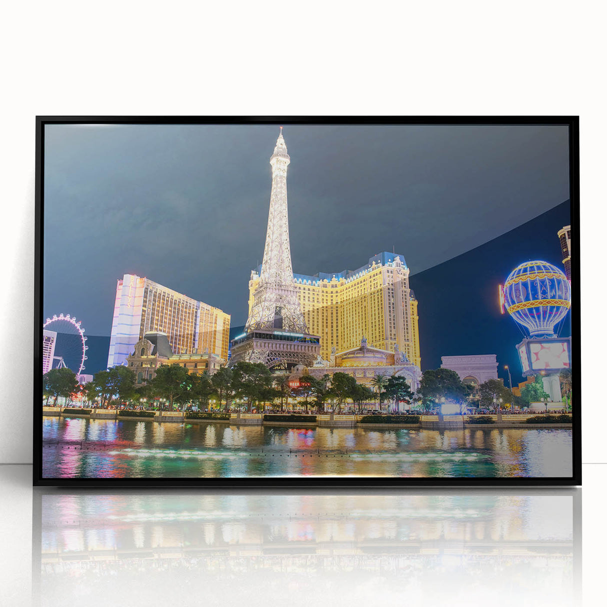 Large abstract wall art of Las Vegas skyline in muted black and gray tones on a framed acrylic.