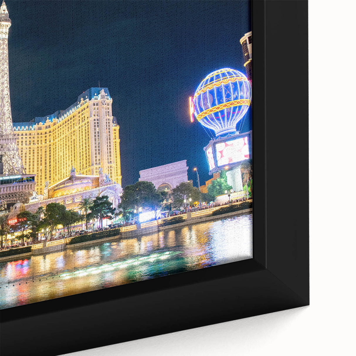Extra large black wall art featuring a textured Las Vegas scenery in colorful hues on framed canvas.