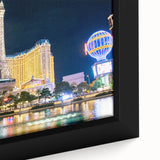 Extra large black wall art featuring a textured Las Vegas scenery in colorful hues on framed canvas.