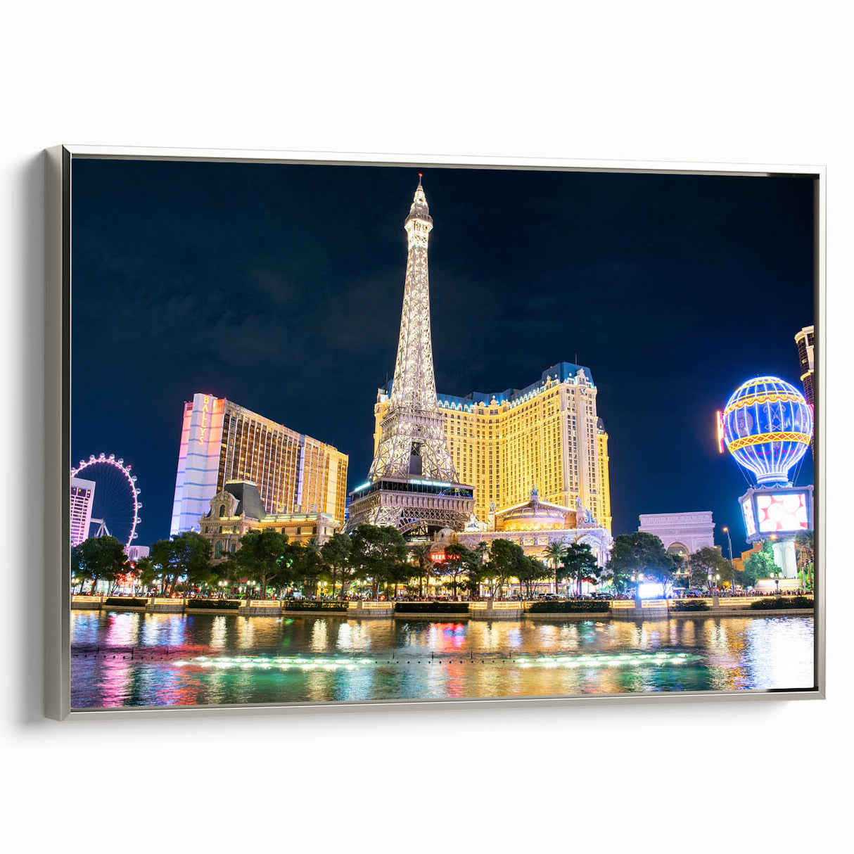 Framed canvas landscape art painting of Las Vegas with colorful accents on black, ideal for modern living room decor.