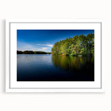 Abstract art print of New Hampshire scenery in muted earth tones on a framed white mat, suitable for dining room decor.