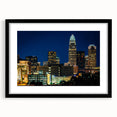 Abstract art print of Charlotte skyline in vibrant colors on a large textured canvas, ideal for living room decor.