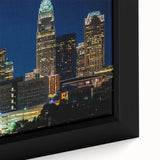 Extra large framed canvas of a textured, colorful Charlotte skyline on black background, ideal for living room decor.