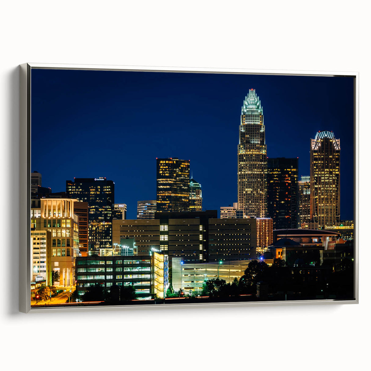 Framed canvas of Charlotte, North Carolina landscape with colorful art in a vintage poster style, ideal for office decor.