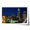 Rolled print of Charlotte, North Carolina skyline in muted gray and blue tones, suitable for dining room wall art.