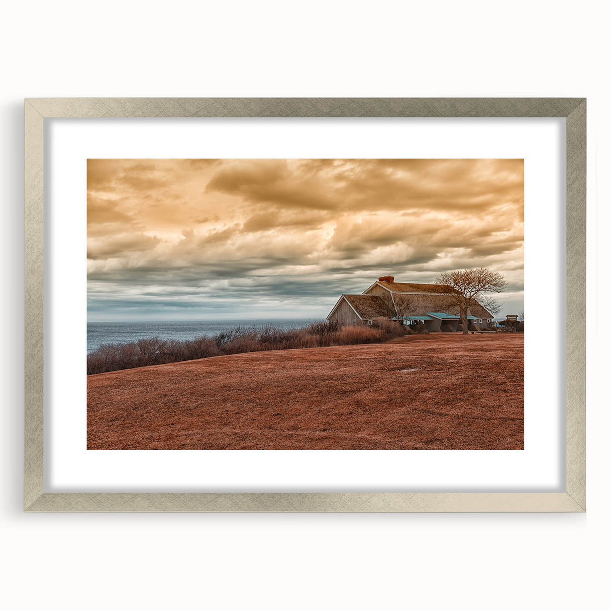 Textured abstract art print of Long Island scenery in muted earth tones, framed in silver, ideal for bedroom decor.