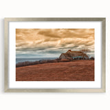 Textured abstract art print of Long Island scenery in muted earth tones, framed in silver, ideal for bedroom decor.
