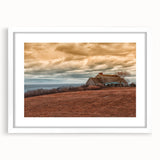 Abstract art print of Long Island scenery in muted green and blue tones, framed in white, suitable for dining room decor.