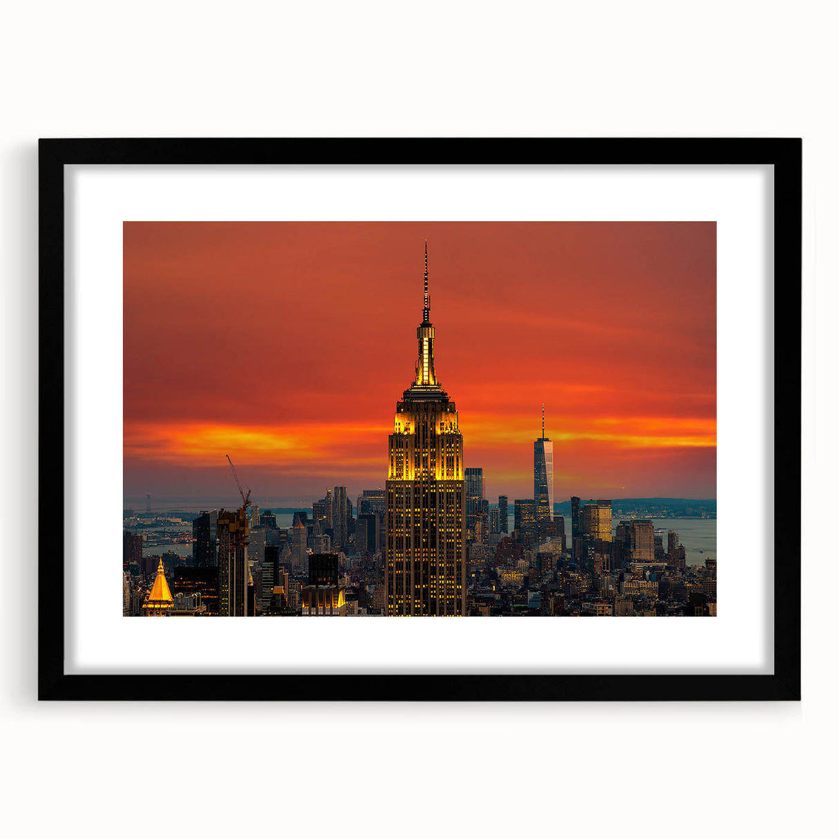 Colorful abstract art print of NYC skyline in vibrant hues on a large framed canvas, ideal for living room decor.