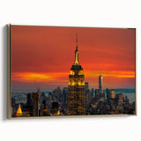 Framed canvas wall art featuring a vintage poster art style depiction of the NYC Empire State Building in black and gold…