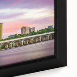 Close-up of a black wall art depicting Oklahoma scenery, with colorful, textured accents on a framed canvas.