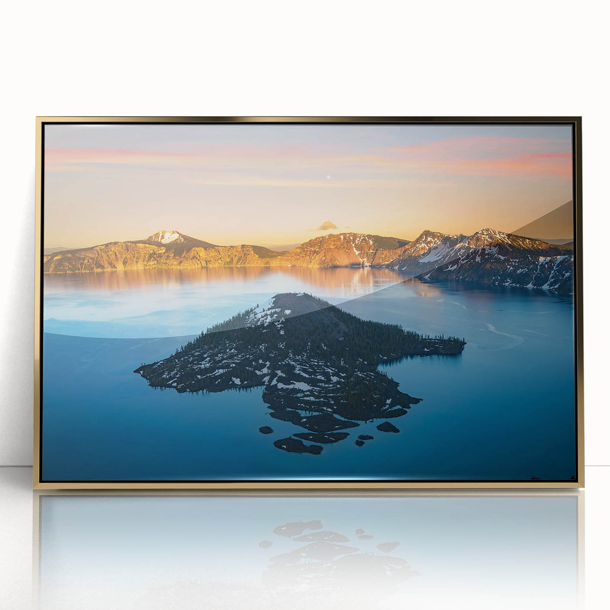 Large art print of Crater Lake, Oregon in muted blue and green tones on a gold-framed acrylic.