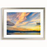 Textured art print of an abstract South Carolina landscape in muted earth tones, framed in silver, ideal for bedroom decor.