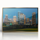 Mid-century modernist style large art print of Houston skyline in muted gold and blue tones on framed acrylic.