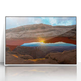 Modern art wall decor featuring a minimalist Arches National Park scene in muted earth tones, acrylic print framed in white.