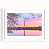 Abstract art print of the Washington DC skyline in muted gray and blue tones on a framed white mat.