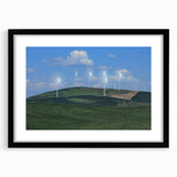 Abstract art print of colorful, textured rolling hills of Palouse, in a large black frame, ideal for living room decor.