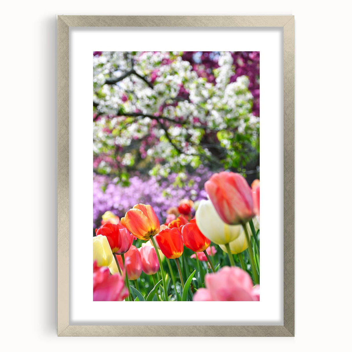 Textured abstract art print depicting spring scenery in pastel shades, framed in silver, ideal for bedroom wall decor.