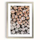 Textured abstract art print depicting a winter scene in muted blue and white tones, framed in silver, ideal for bedroom art.