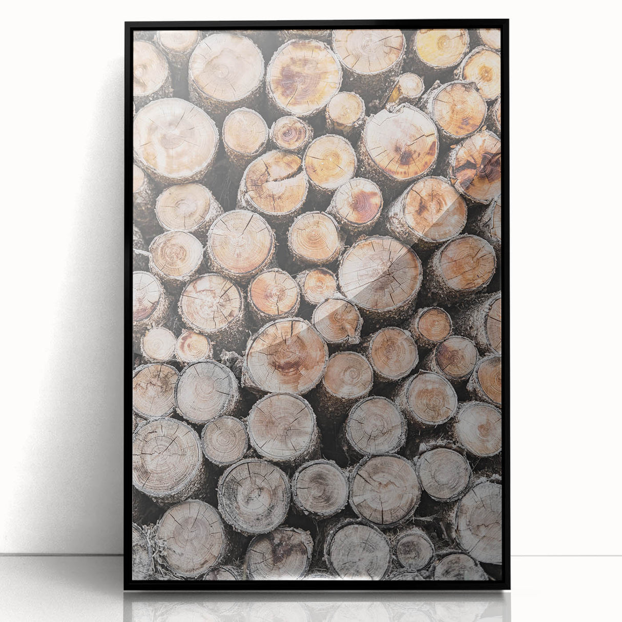 Large abstract wall art depicting a winter scene in muted blue and gray tones, framed in black acrylic.