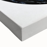 Close-up view of a stretched canvas artwork featuring vibrant geometric patterns in bold colors, ideal for modern home decor or art collectors. The intricate design highlights sharp angles and dynamic shapes, enhancing any living space with contemporary flair.