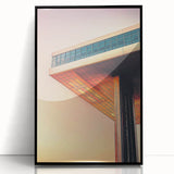 Large abstract wall art featuring geometric shapes in muted gray and blue on framed acrylic.