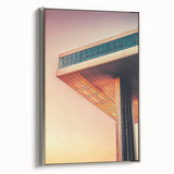 Framed canvas featuring a black and white vintage poster of a cityscape with colorful abstract elements.