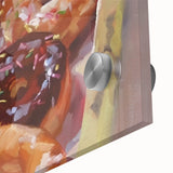 Close-up of large abstract wall art featuring assorted pastries in vibrant colors on acrylic glass.