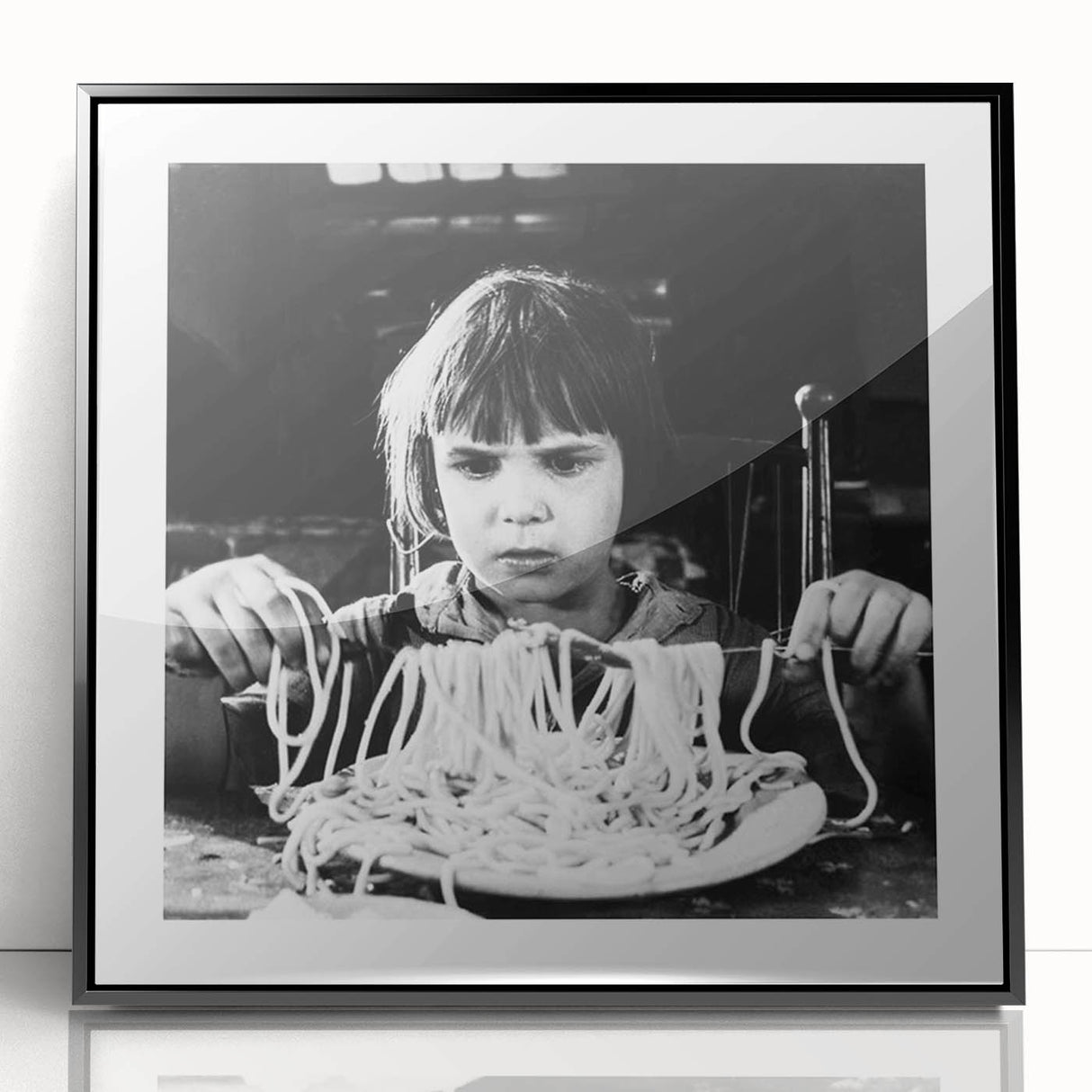 Large abstract wall art featuring indistinct figures in black and white, framed in acrylic.