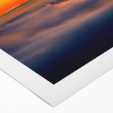 Rolled canvas displaying a vibrant African tribal wall art design, showcasing intricate patterns and bold colors, elegantly packaged in a protective cardboard tube. Perfect for home decor enthusiasts seeking unique cultural art pieces.