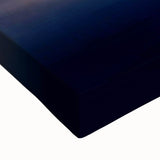 Close-up of a stretched canvas artwork featuring an intricate African tribal design, showcasing vibrant colors and detailed textures, perfect for home decor.