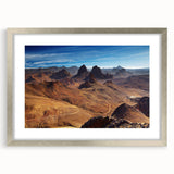 Abstract art print of Algerian landscapes in muted earth tones on a silver-framed canvas.
