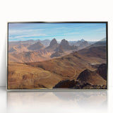 Art deco poster depicting a serene Algerian landscape in muted earth tones, framed in silver acrylic.