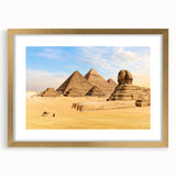 Textured abstract art print of an African landscape in gold and earth tones, framed with a mat, ideal for bedroom decor.