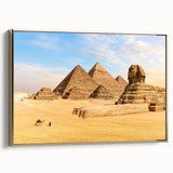 Framed canvas depicting a vintage Egyptian landscape with pyramids, in gold and black tones, ideal for office decor.