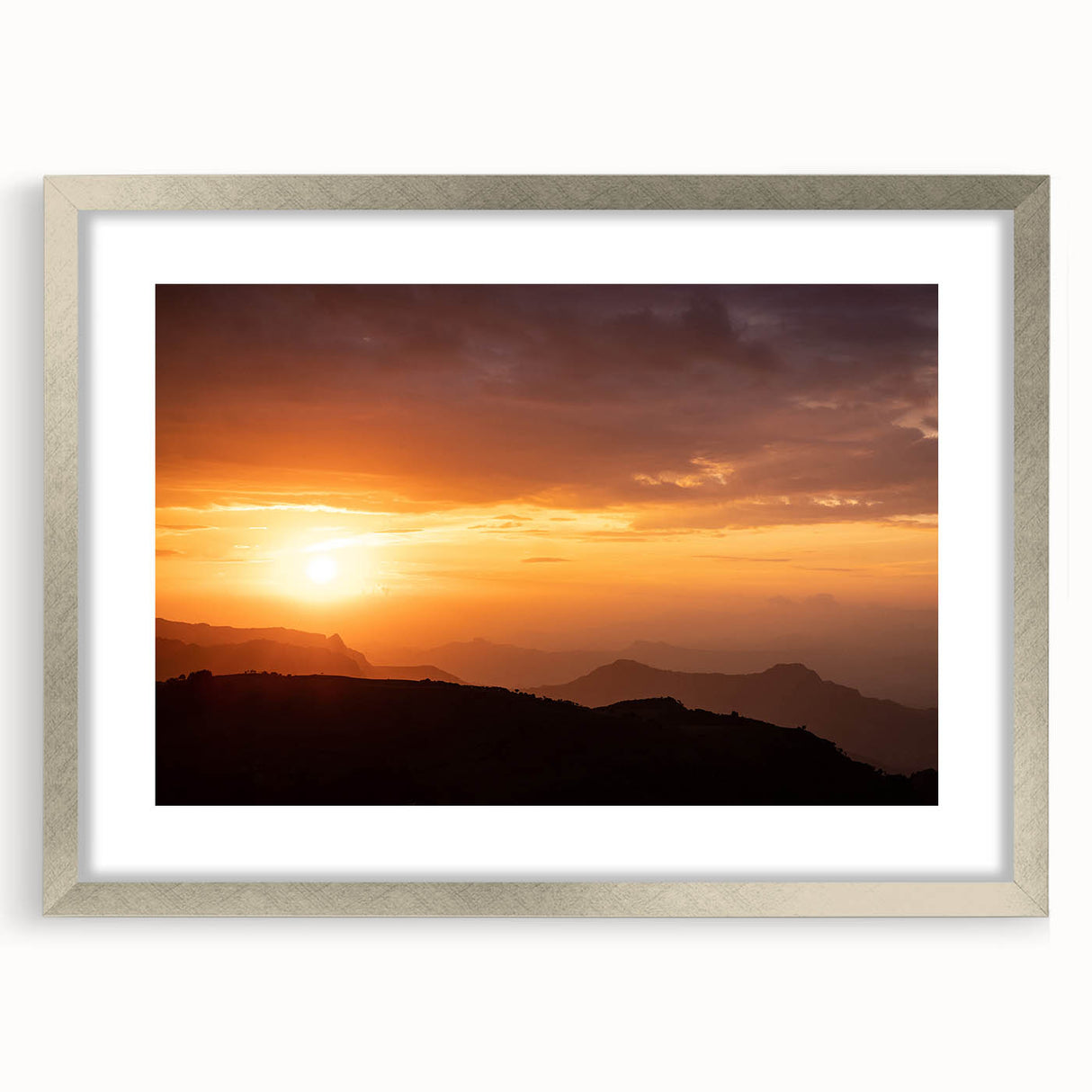 Abstract art print of an Ethiopian landscape in muted earth tones on a framed silver canvas, suitable for dining room decor.