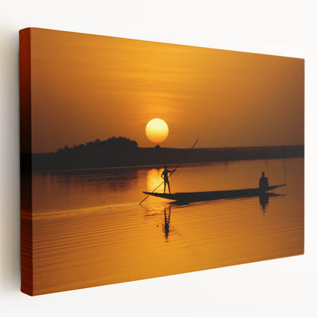 African savannah scene with elephants and sunset in warm orange and yellow tones on stretched canvas.