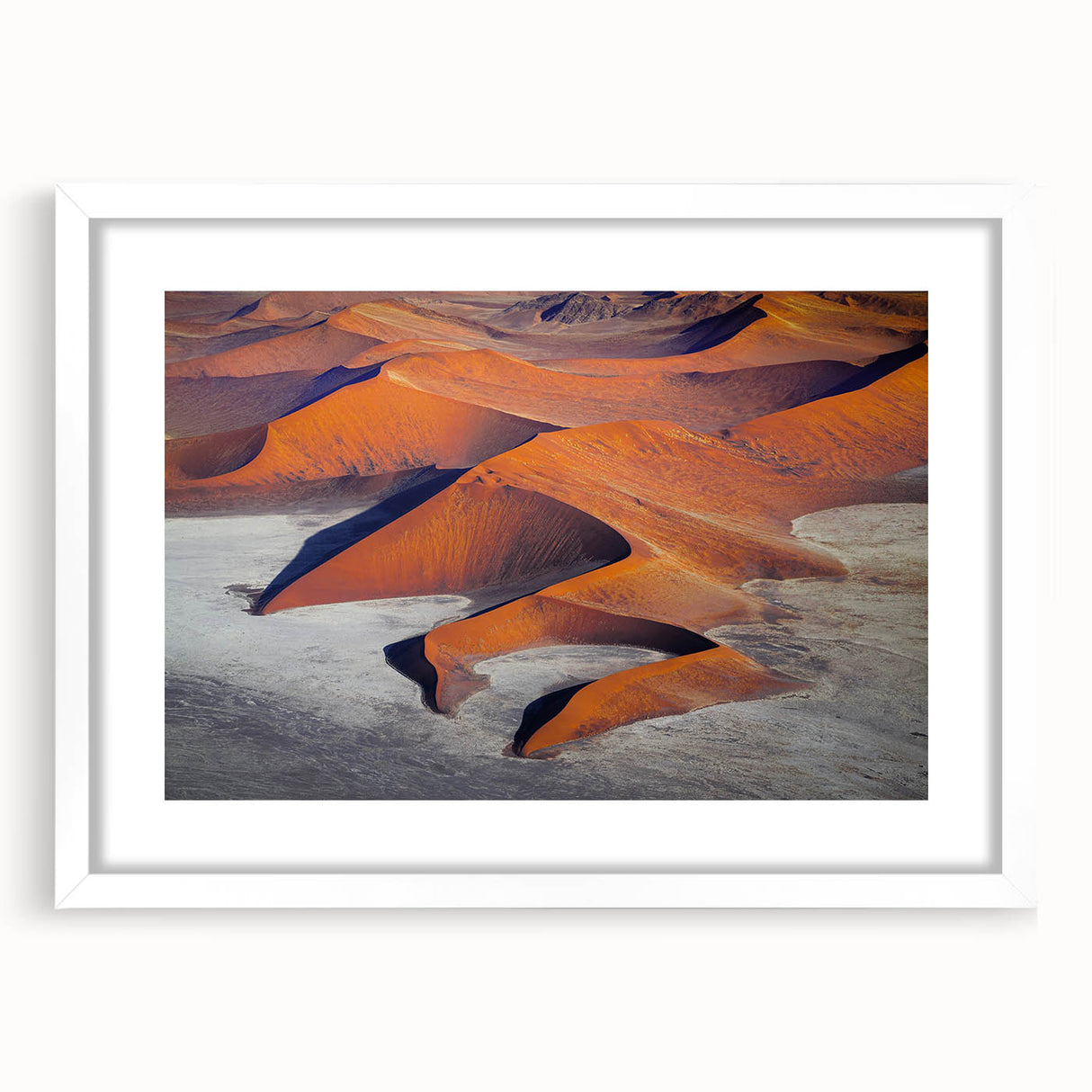 Extra large abstract art print of a textured Namibian landscape in muted earth tones, framed with a white mat.