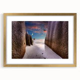 Extra large abstract art print of Seychelles scenery in muted earth tones, framed in gold with a mat.