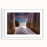 Abstract art print of Seychelles scenery in muted blue and green tones on a framed white mat.
