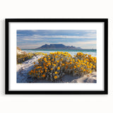 Extra large colorful abstract art print of a stylized African scenery on textured canvas, framed in black.