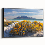 Black and white wall art featuring a vintage poster-style landscape of an African scenery on a framed canvas.