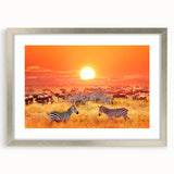 Textured art print of an abstract African scenery in earth tones, framed in silver, ideal for bedroom decor.