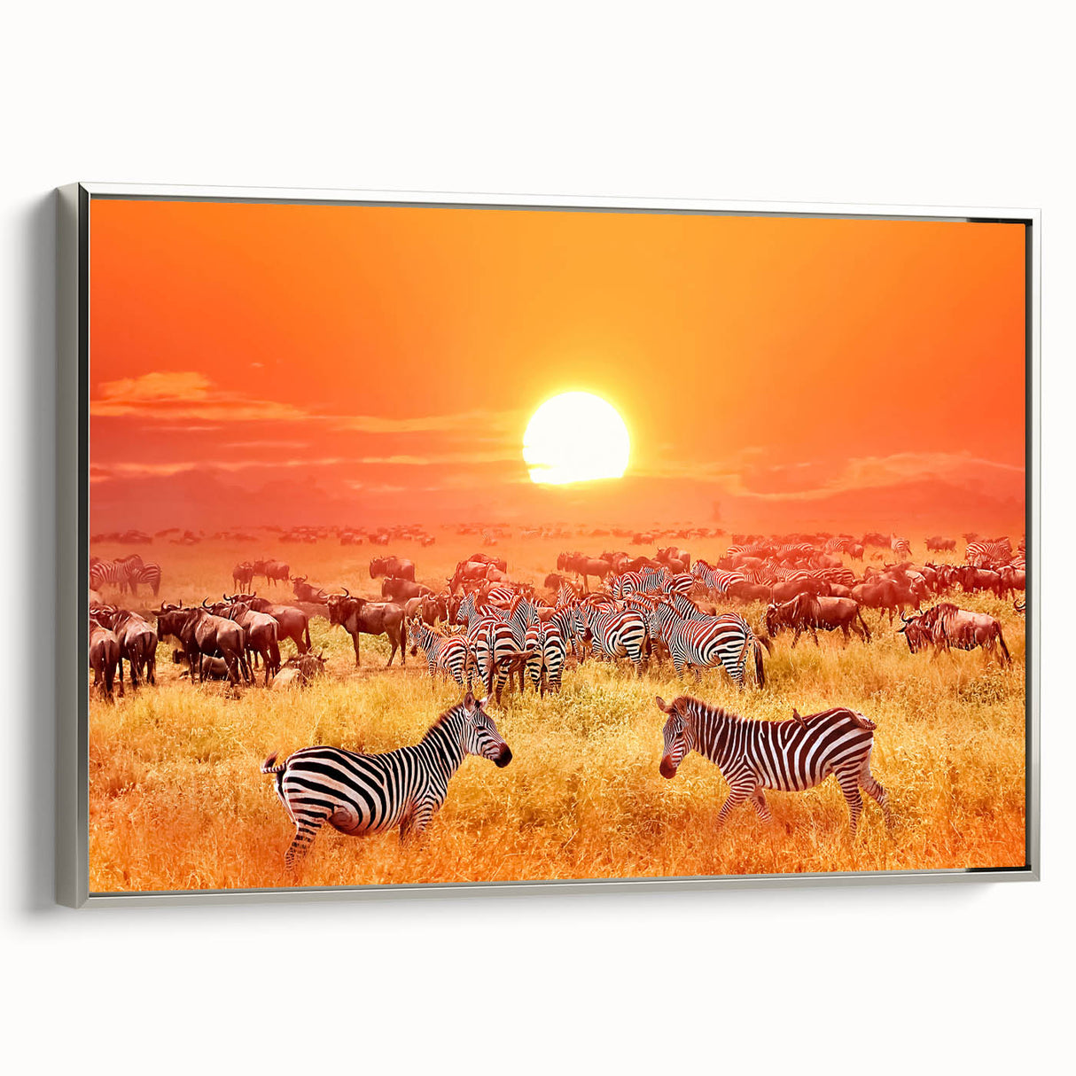 Landscape art painting depicting a Tanzanian scenery in vibrant colors, framed in silver on canvas.