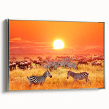 Landscape art painting depicting a Tanzanian scenery in vibrant colors, framed in silver on canvas.