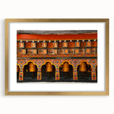 Extra large abstract art print of a Bhutanese landscape in textured gold frame, ideal for living room decor.