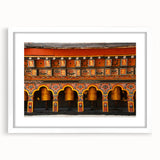 Abstract art print of a Bhutanese landscape in muted earth tones on a framed white mat, ideal for dining room decor.